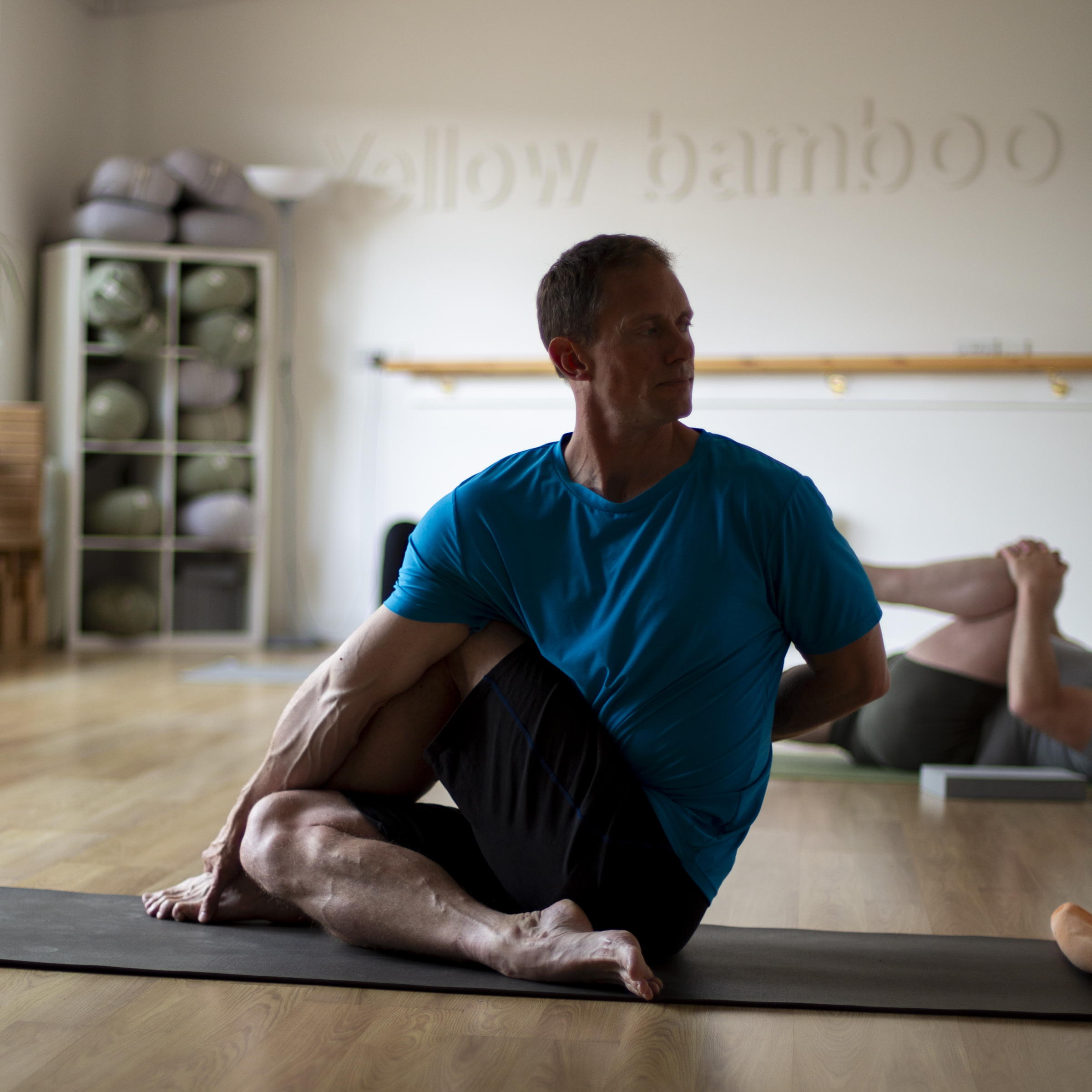 Mark performing a seated twist in full mindfulness